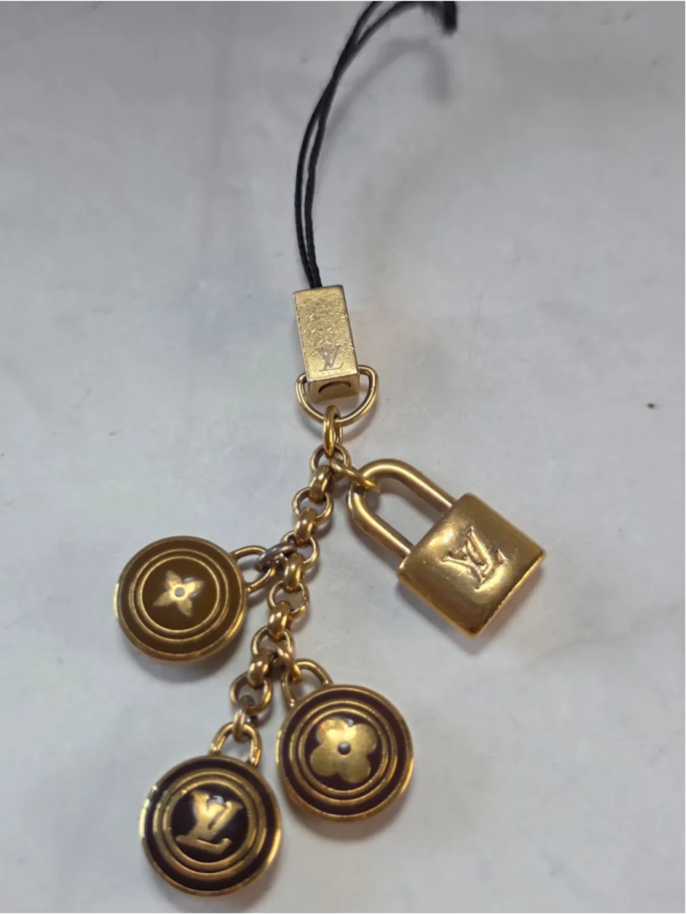 Louis Vuitton Gold-Tone Monogram Lock & Charm Phone Strap